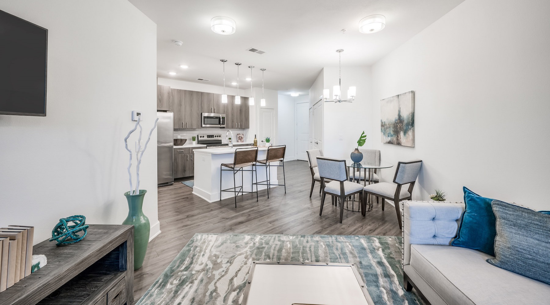 Spacious well lit living room with wood floors 