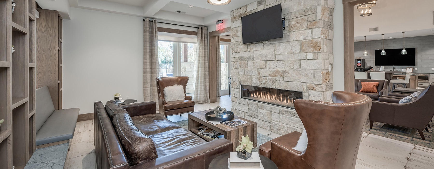 Large clubroom with fire place and ample seating 